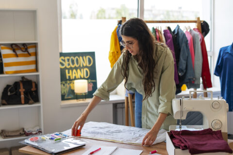 medium-shot-woman-repairing-clothes